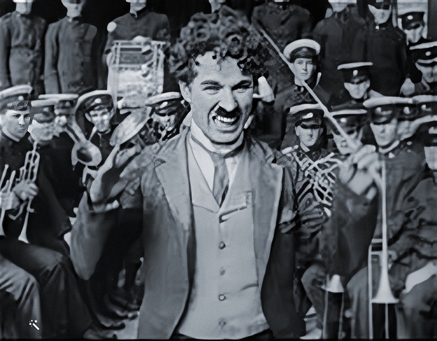 charlie conducting a band at the hippodrome