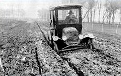 model t ford on a rutted country road